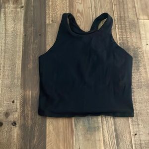 This is a black tank top from Athleta Girl. Size L/12.